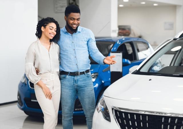 Couple looking at car